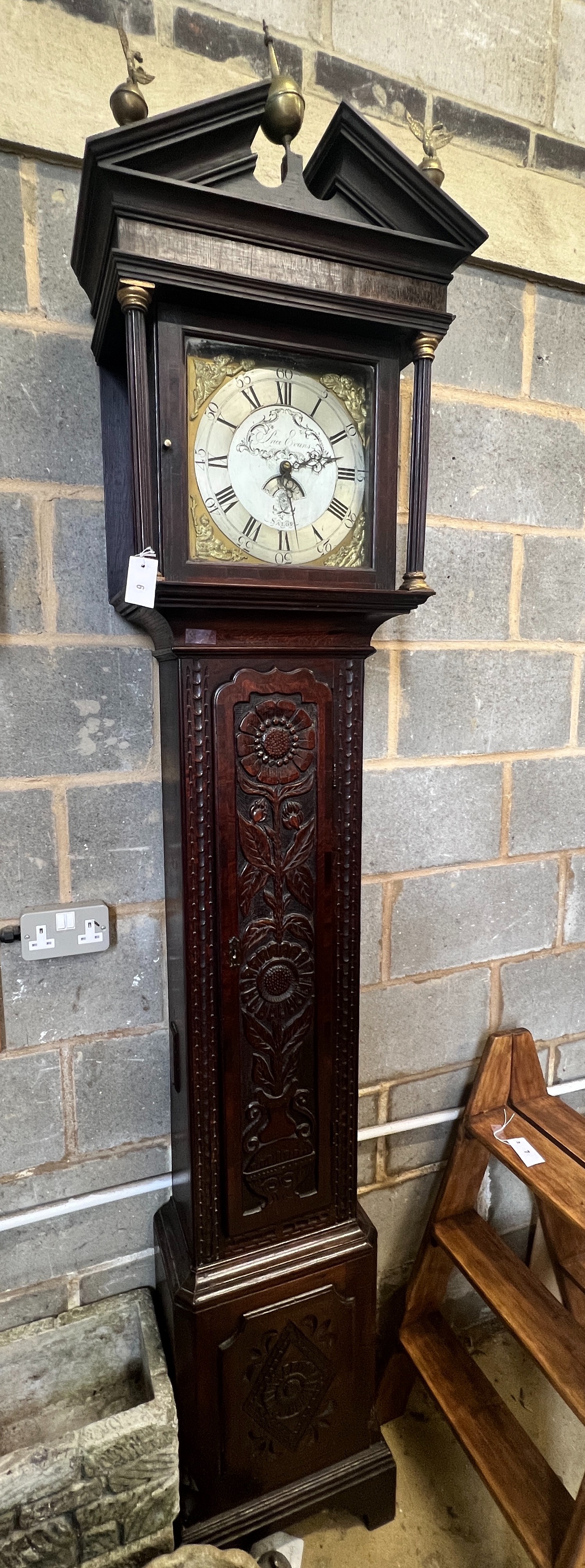A George III later carved oak cased 30 hour longcase clock, marked Evans, Salop, height 234cm